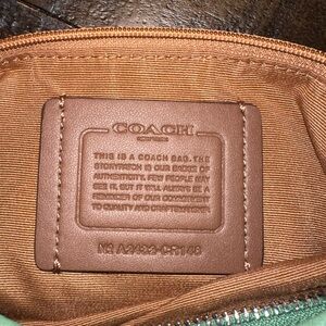 Medium coach hobo. Light green pebble leather. Comes with crossbody strap.